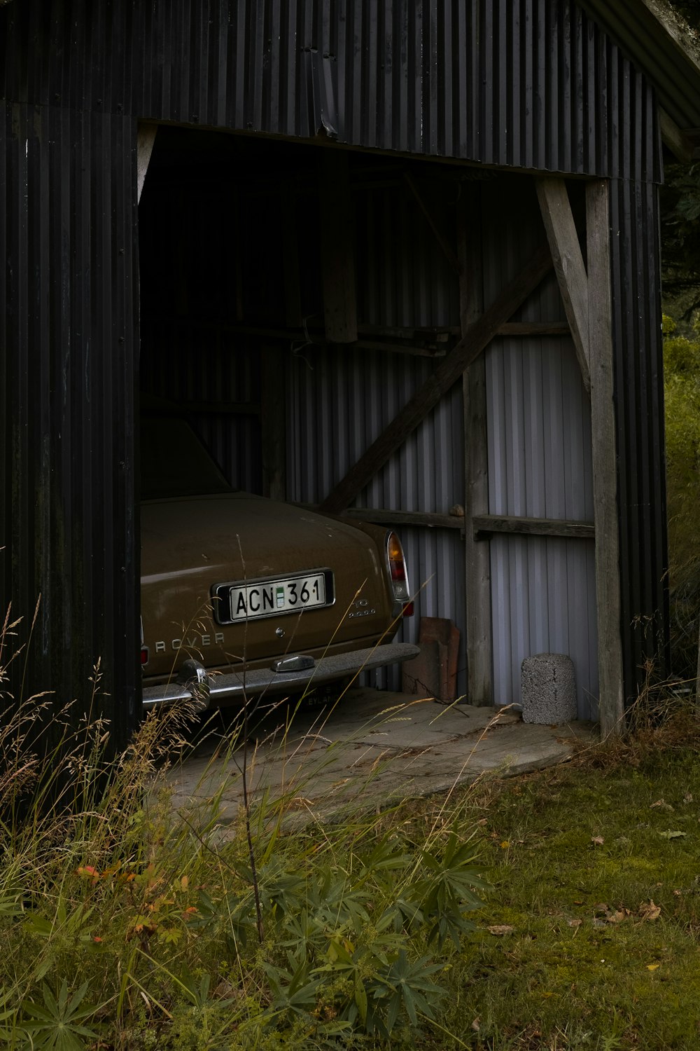 brown vehicle inside garage