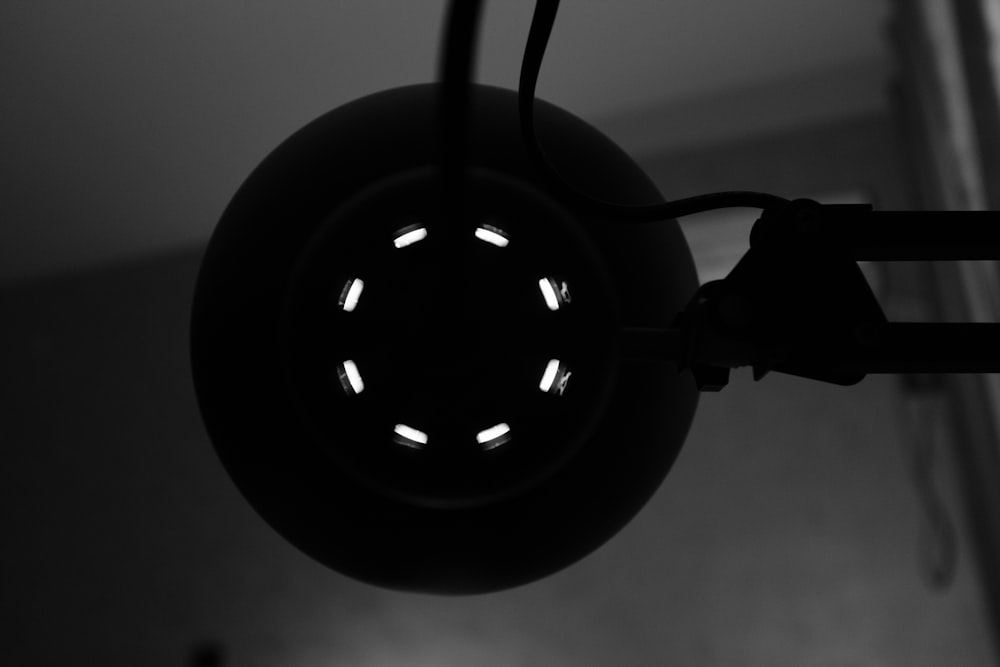 a black and white photo of a light fixture