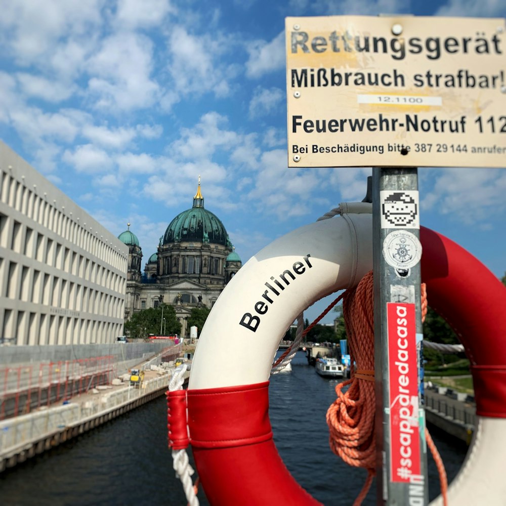 white and red Berliner swimming ring