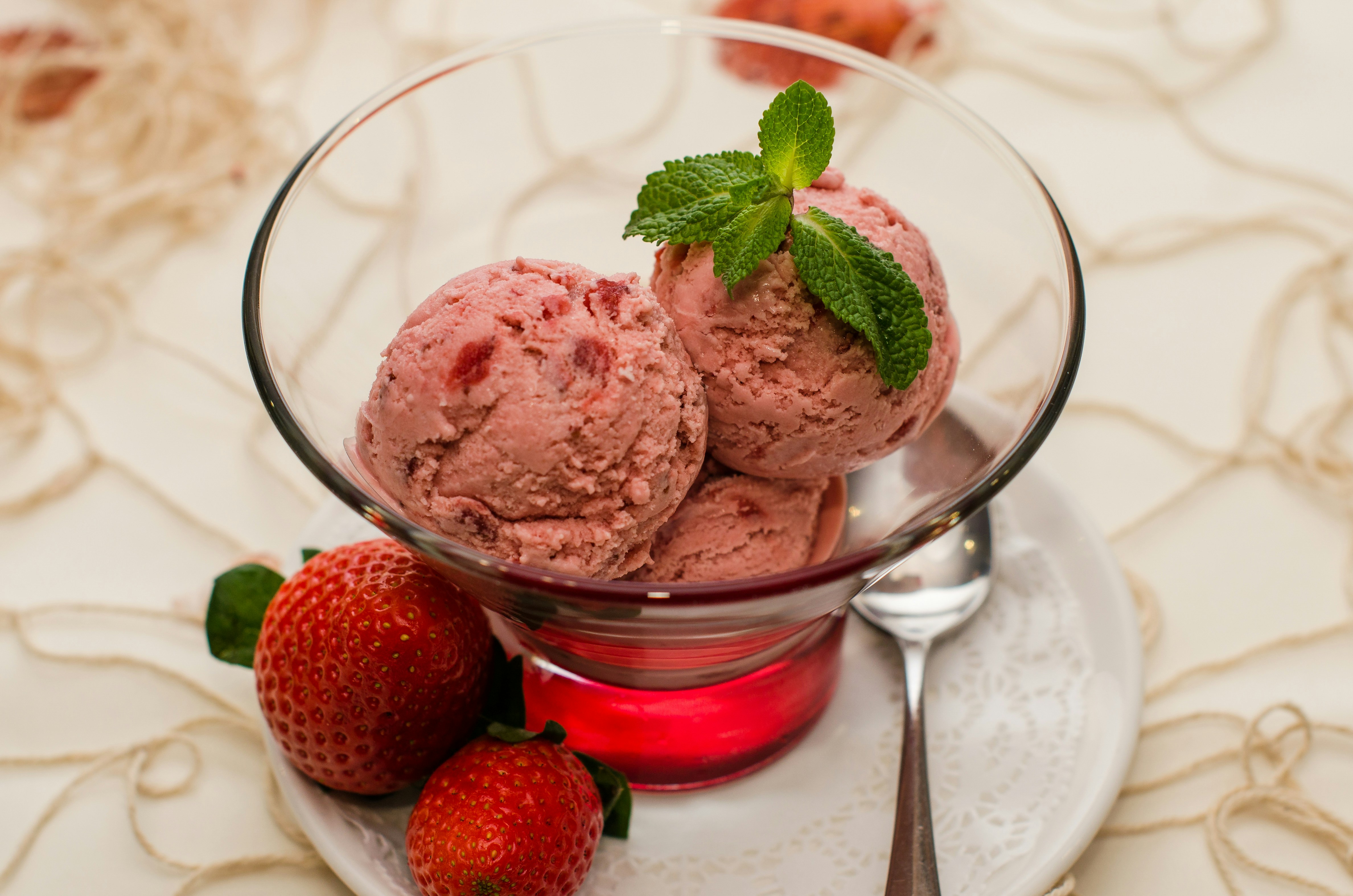 A tub of fresh strawberry ice cream.