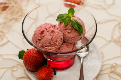 Berry ice cream sundae in a glass with fresh fruit