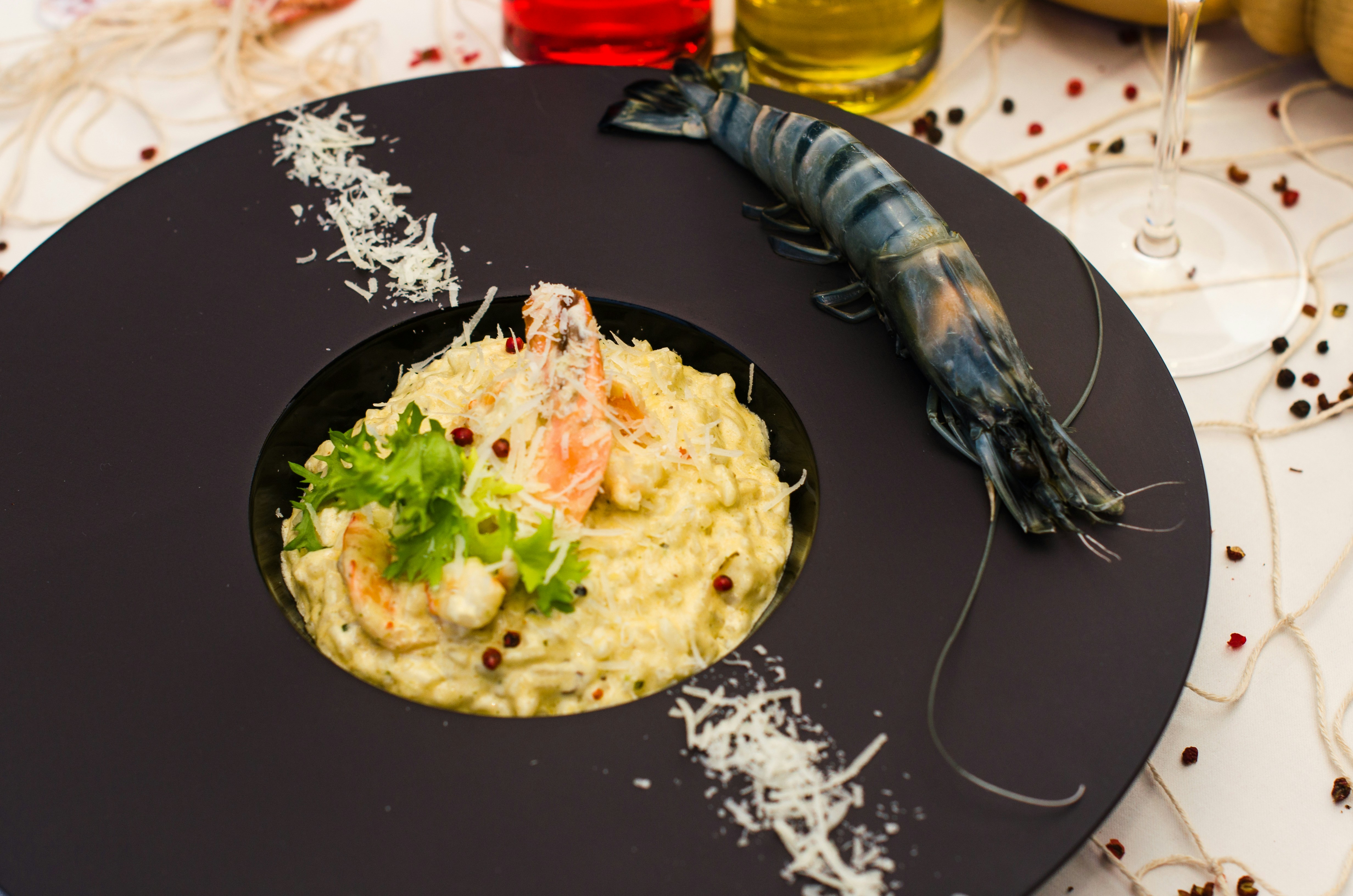 Prawn risotto on a black plate