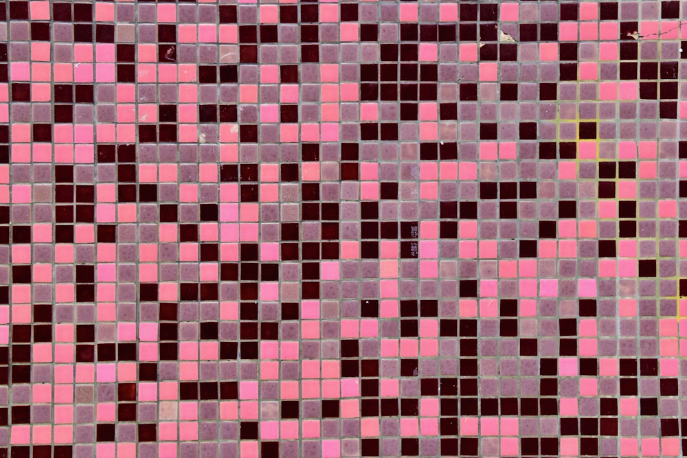 a pink and brown mosaic tile pattern with a white background