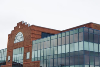 A modern commercial building constructed with red clay bricks.