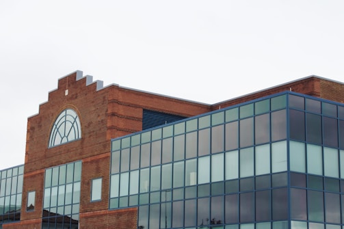 A modern commercial building constructed with red clay bricks.