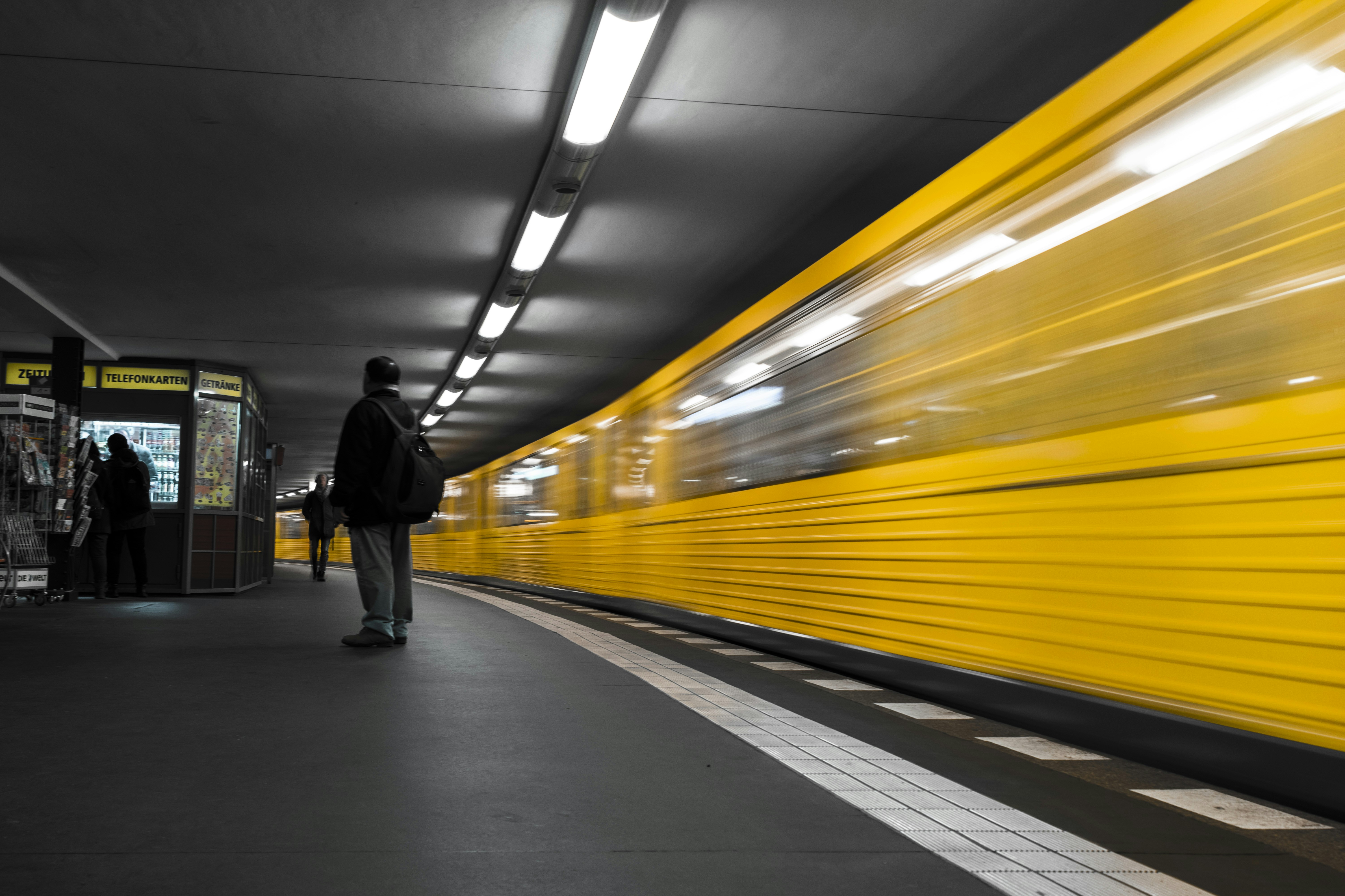 Three happy friends in yellow shirts ready for a tropical vacation.