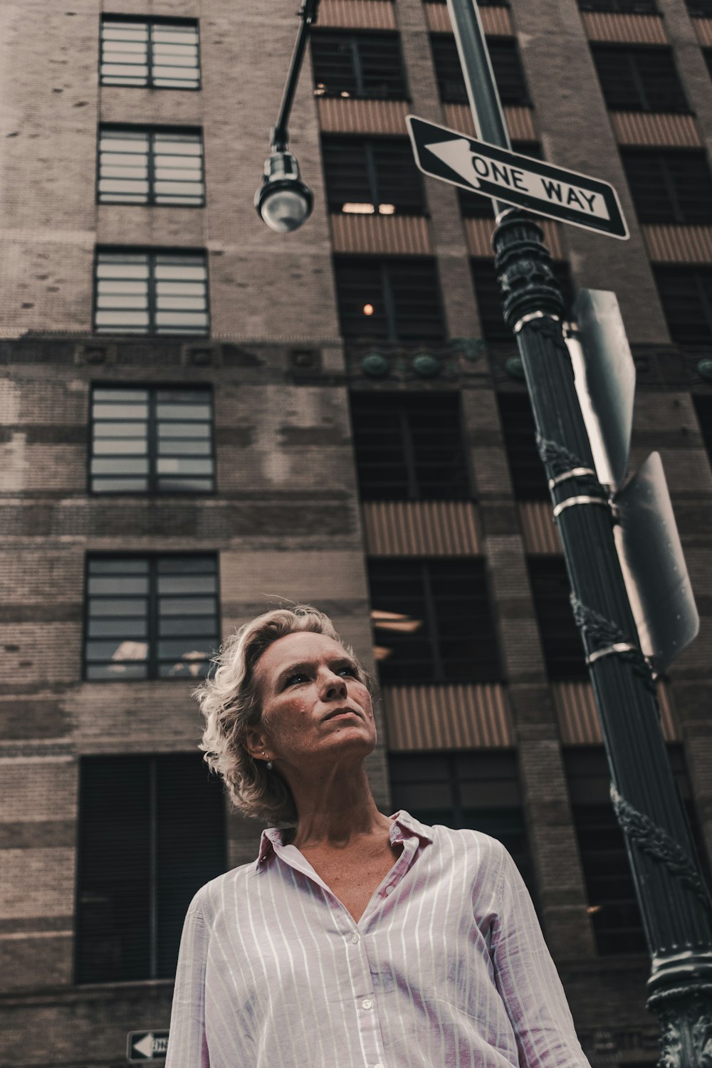 woman near street signage