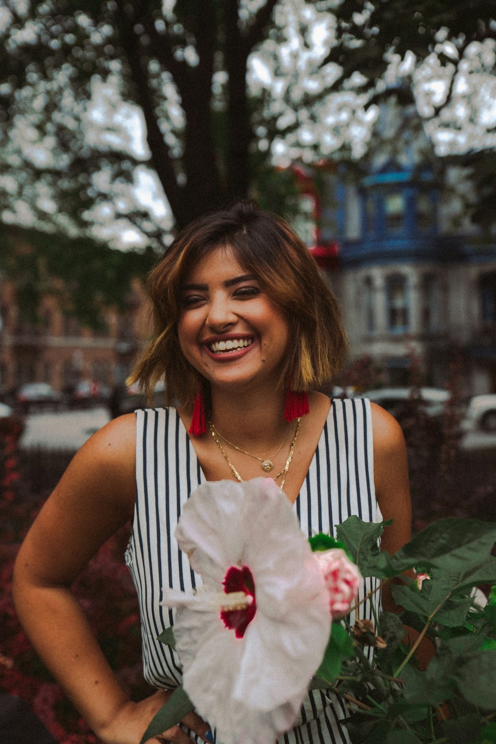 woman near white flower