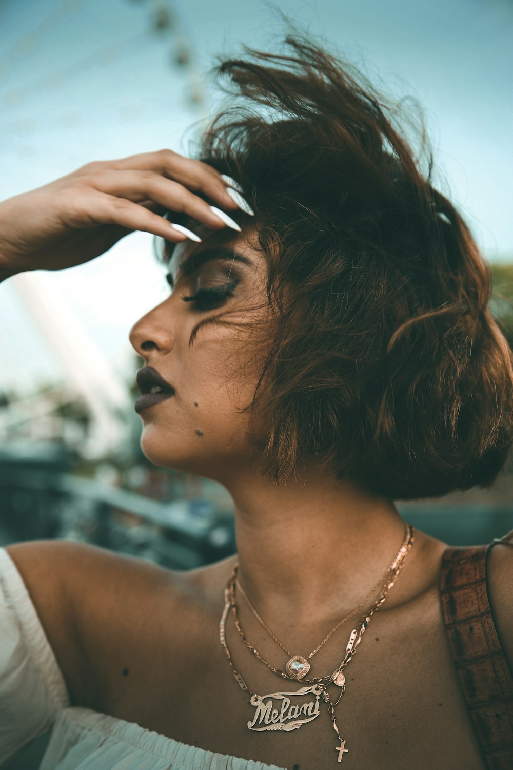 woman holding her forehead