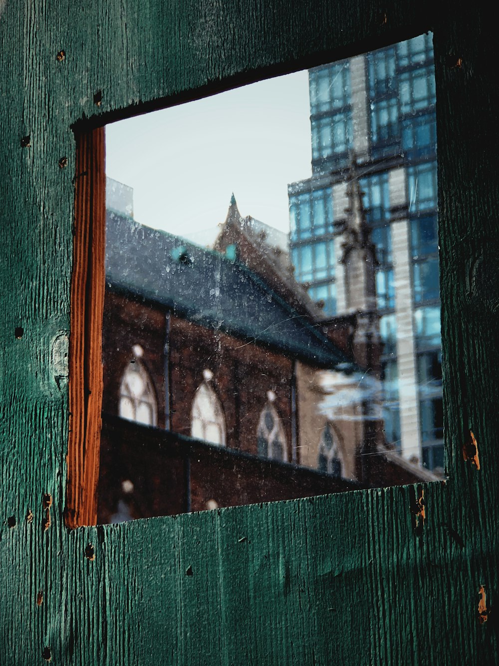 a picture of a building taken through a window