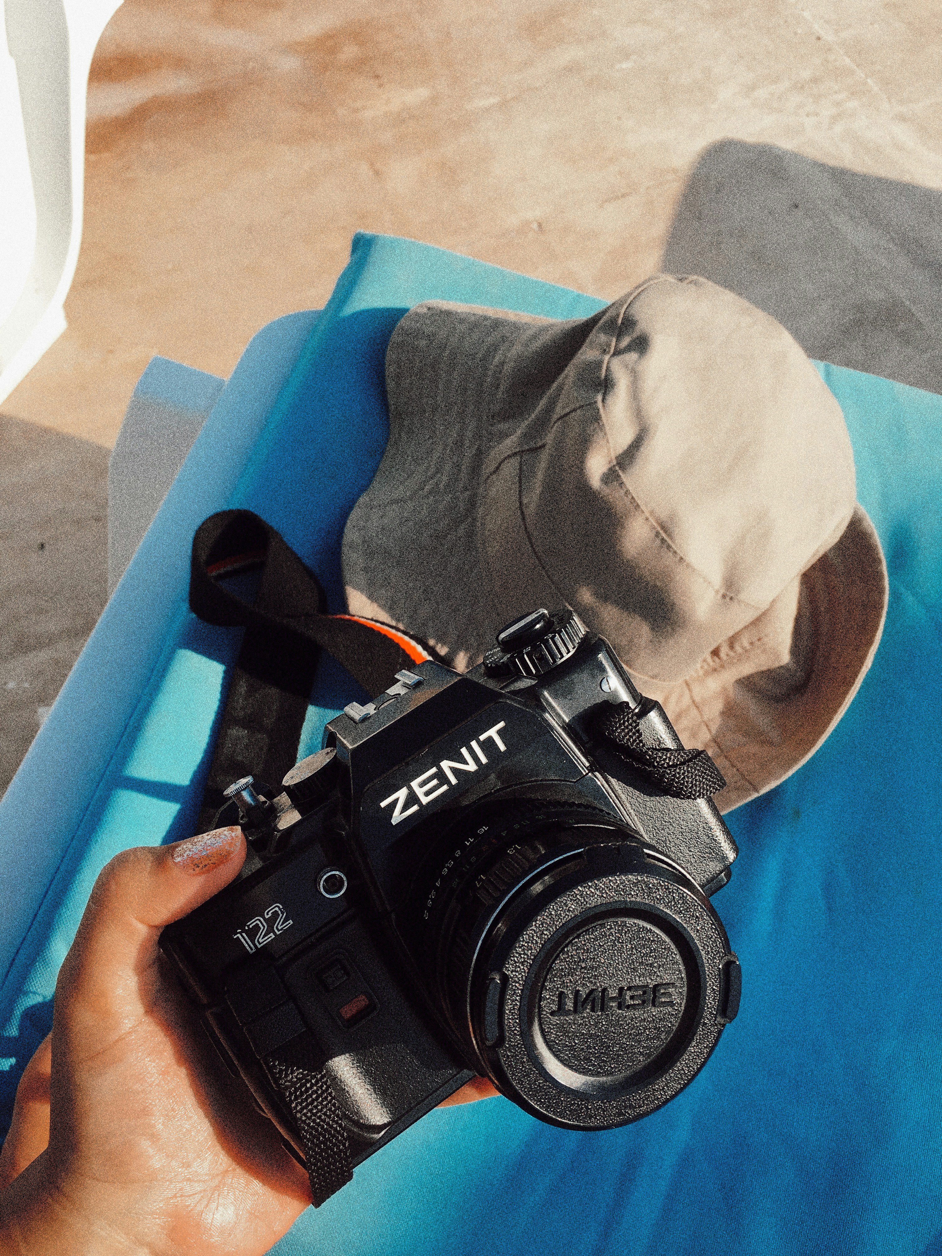 person holding Zenit DSLR camera