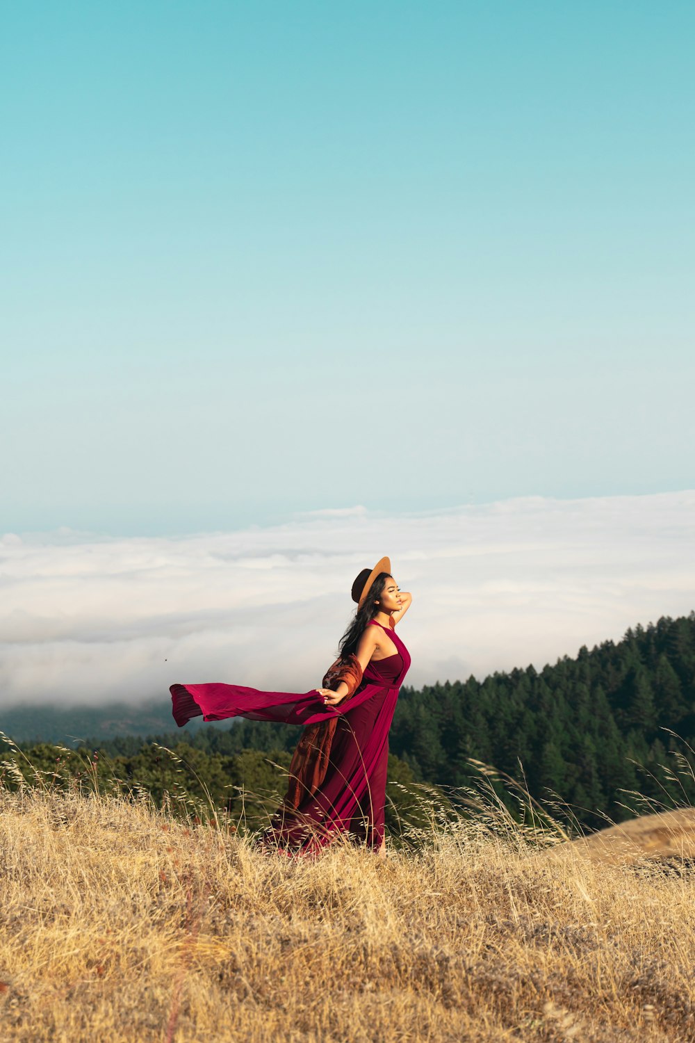 woman standing on brown field