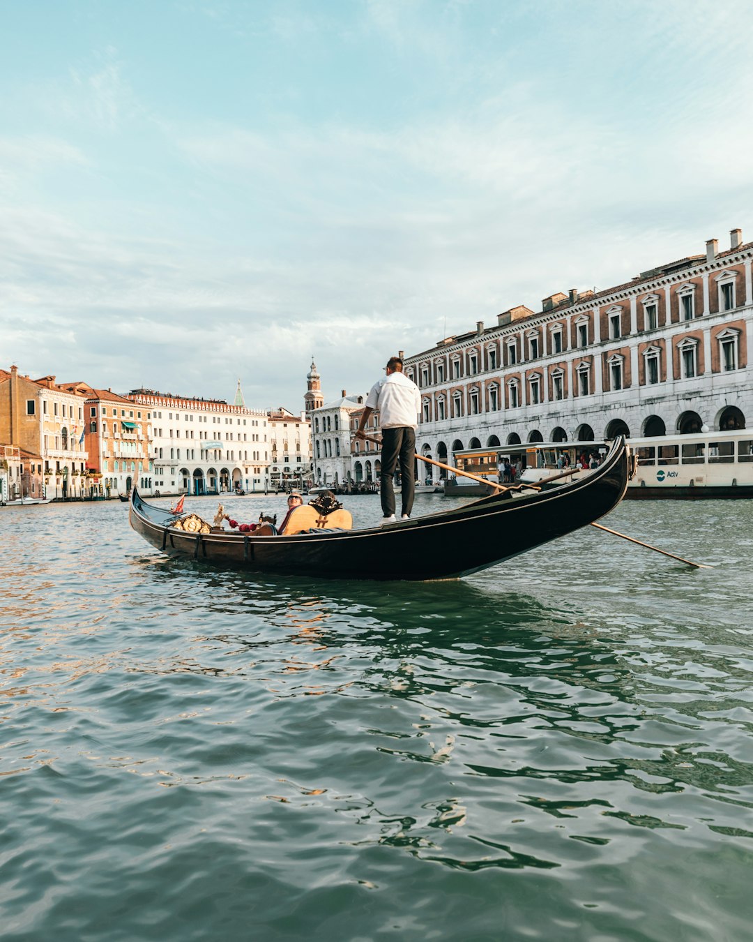 people sitting on boat on calm water at daytime