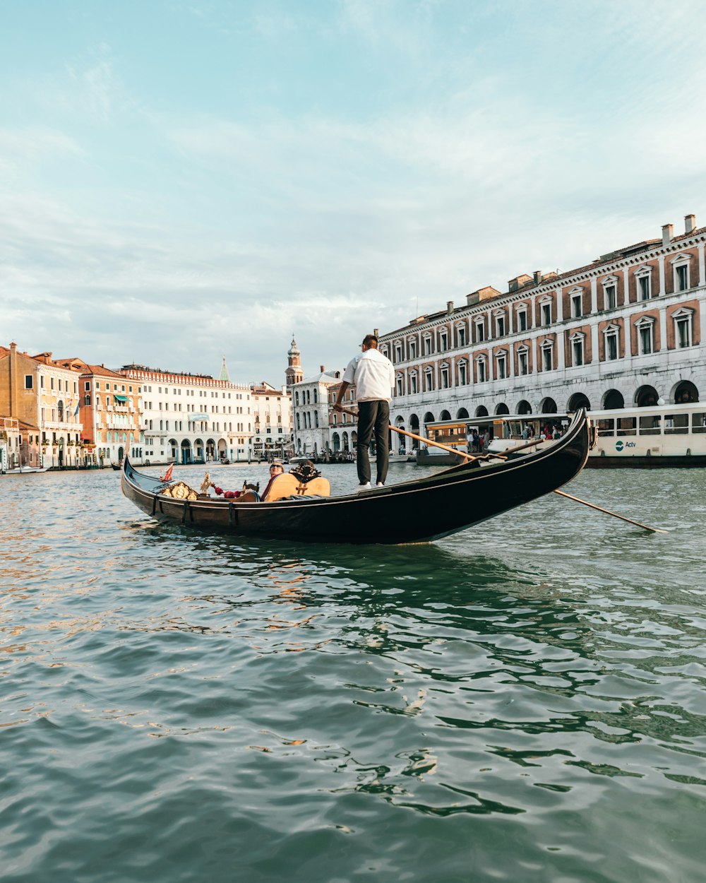 people sitting on boat on calm water at daytime