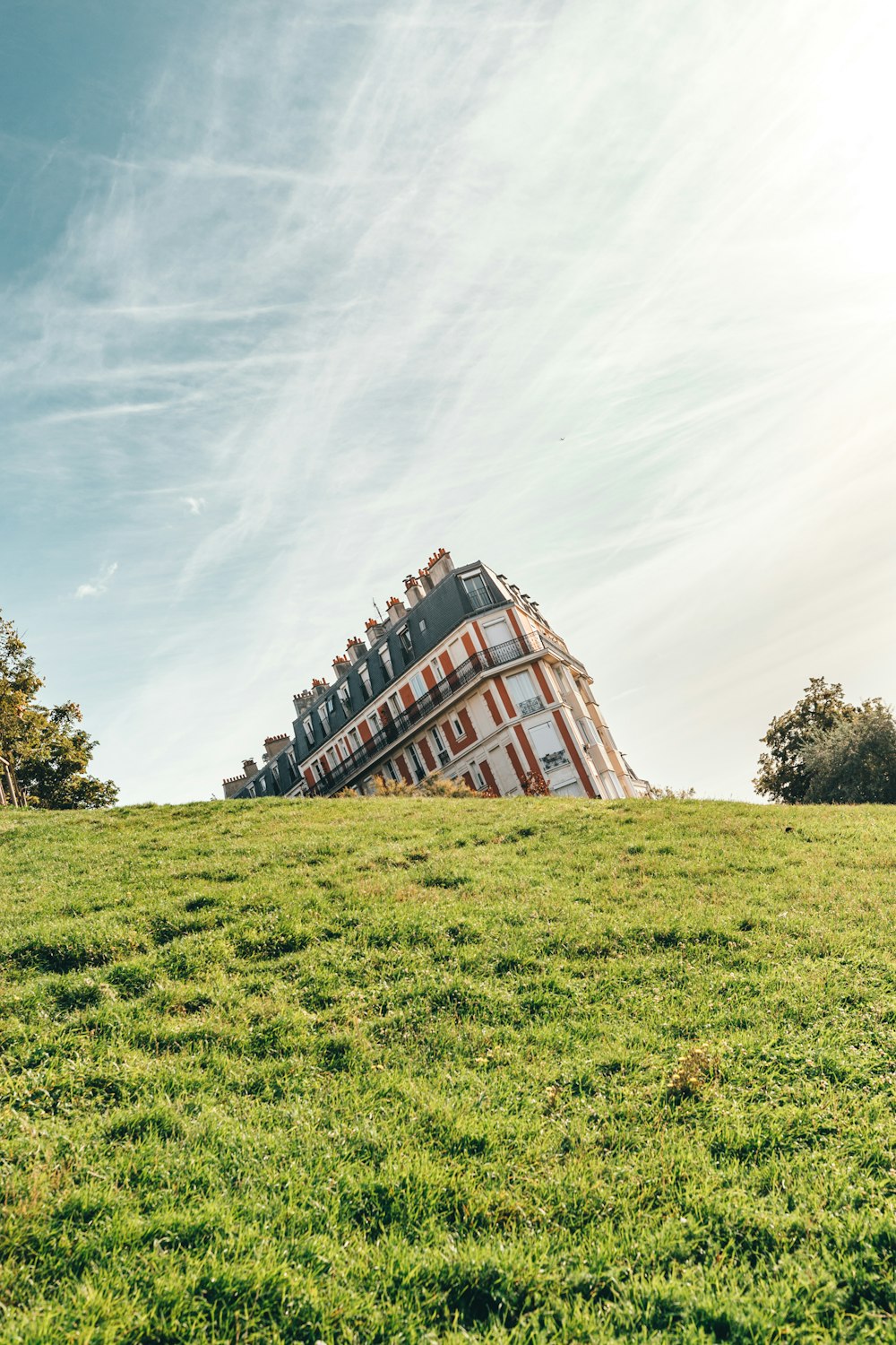 concrete building on grass field during daytime