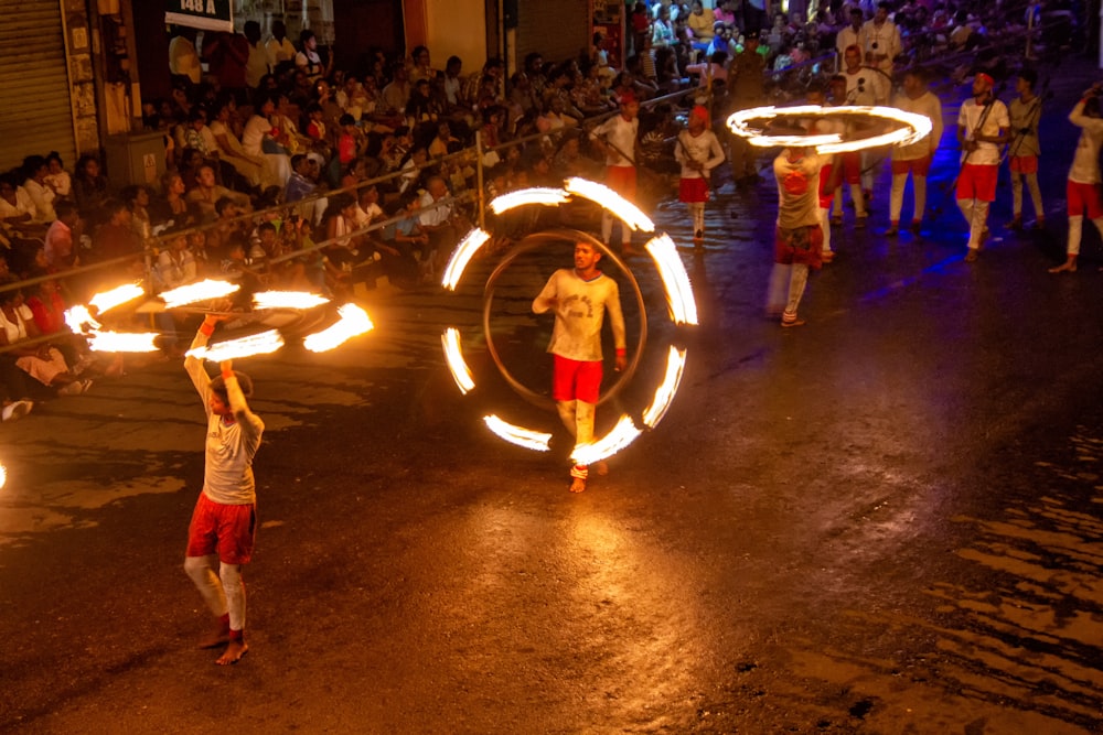 three person about to fire dancing