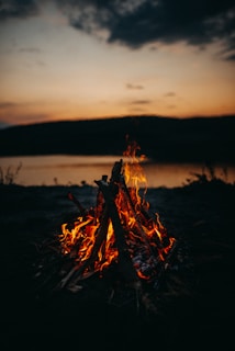 bonfire in green field during night time