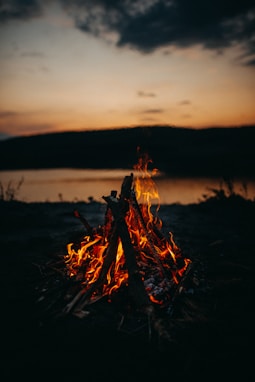 bonfire in green field during night time
