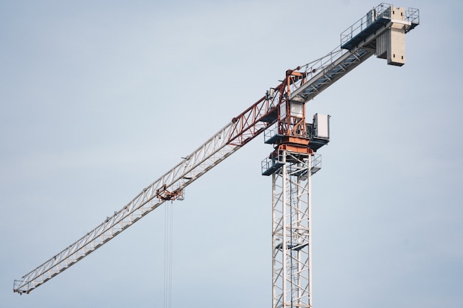 A tower crane rising over a high-rise construction site, similar to the equipment needed to build the new Strip resort