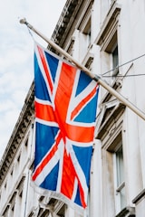 a union jack flag hanging from a building