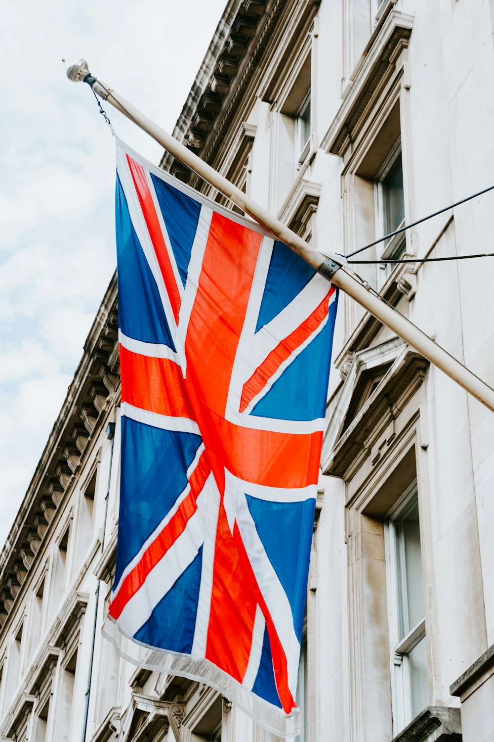a union jack flag hanging from a building