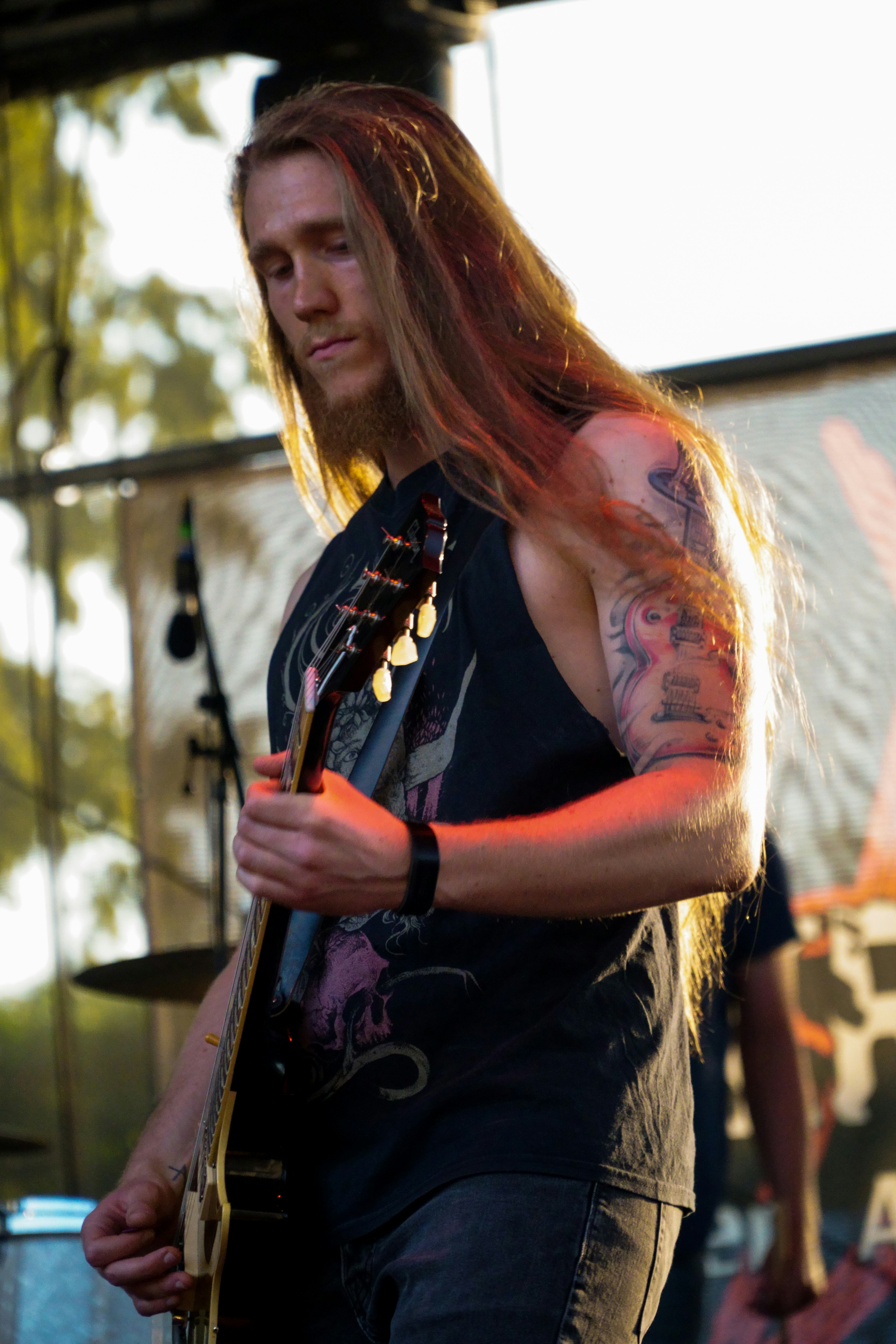 2019//07//26 Man with a tattoo is playing a guitar