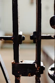 Close-up of a steel gate frame with clean, precise welds in a workshop.