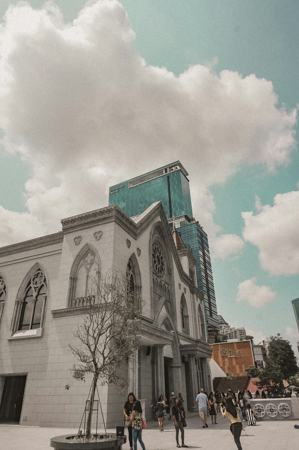 white concrete cathedral under cloudy sky