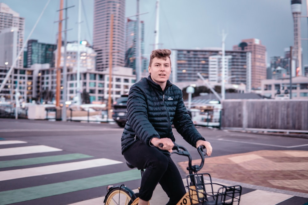 man driving bicycle on street