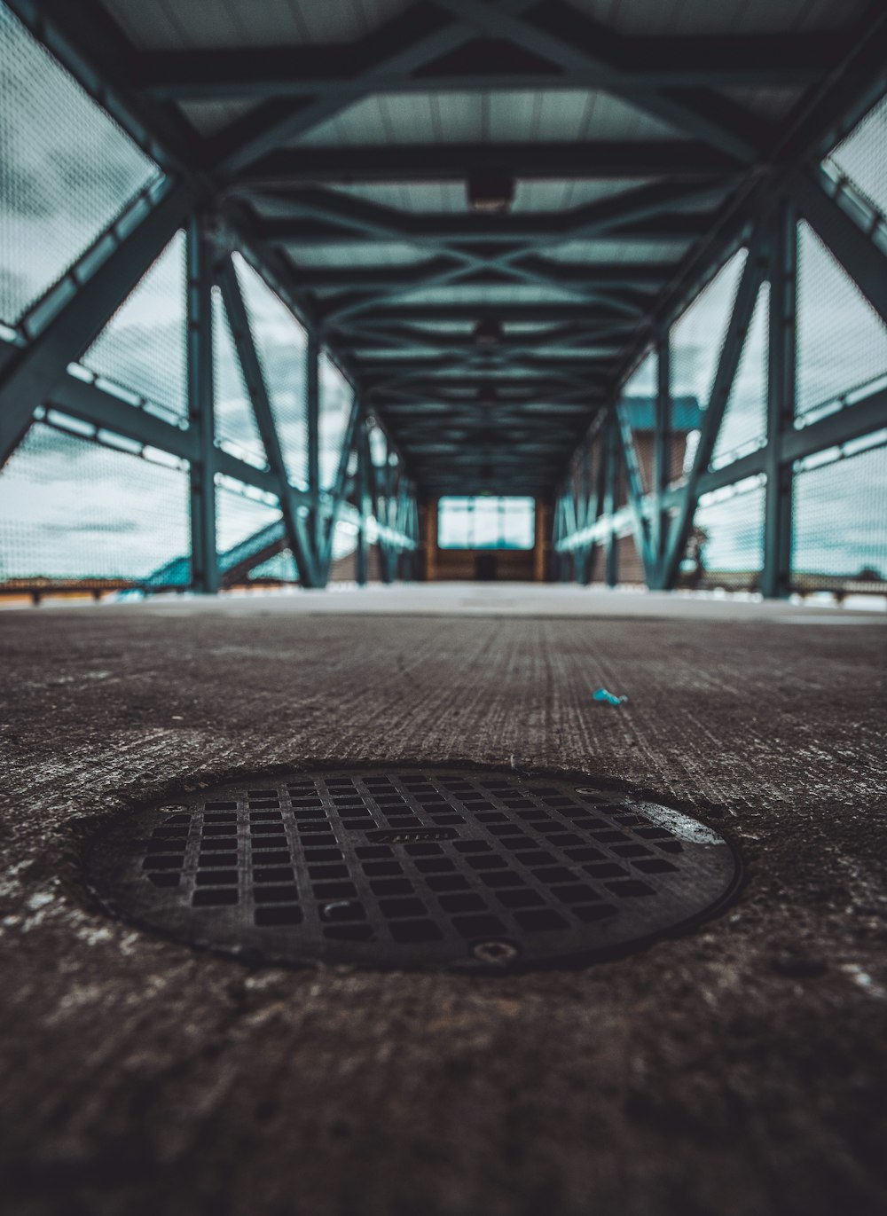 a manhole cover in the middle of a walkway