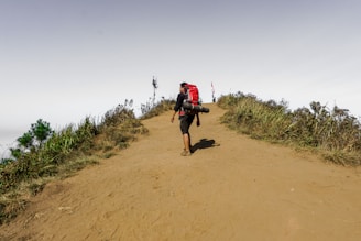 man standing on hills