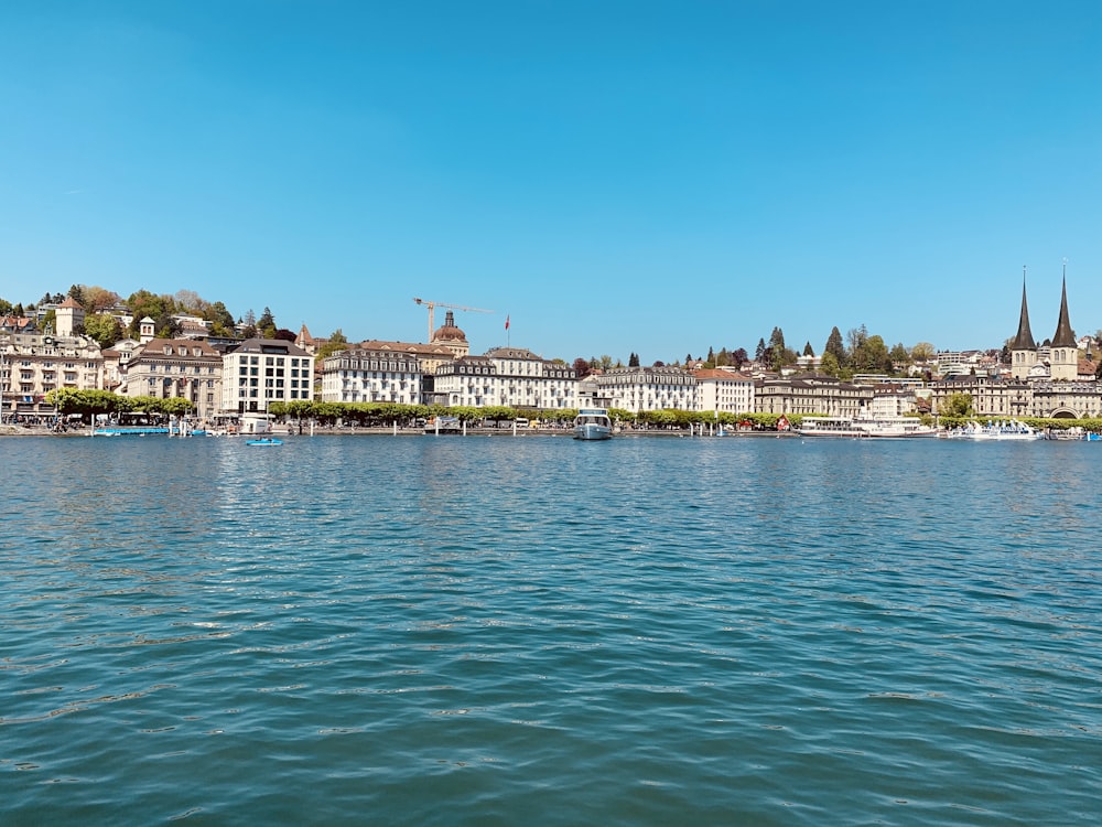 houses and buildings near blue sea during daytime