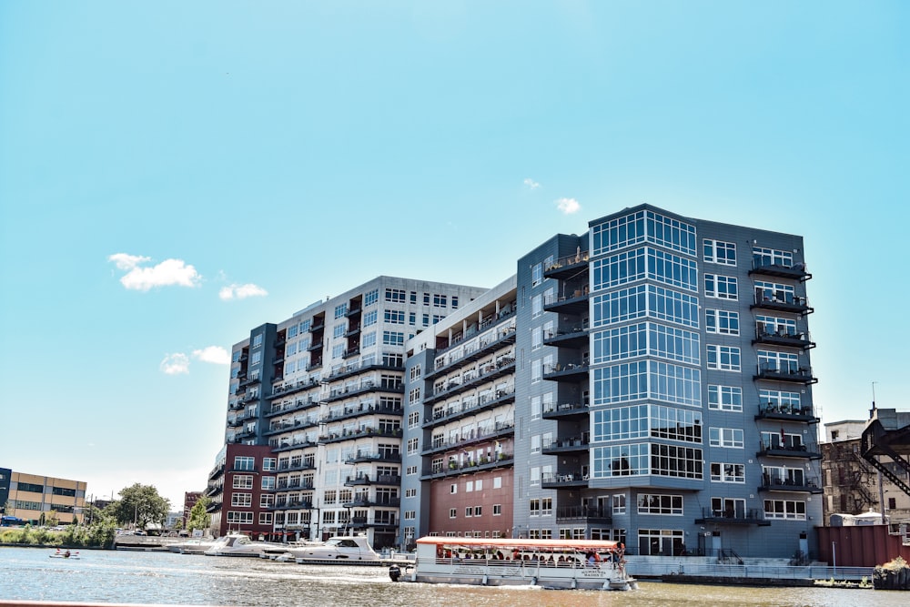 gray concrete building near body of water