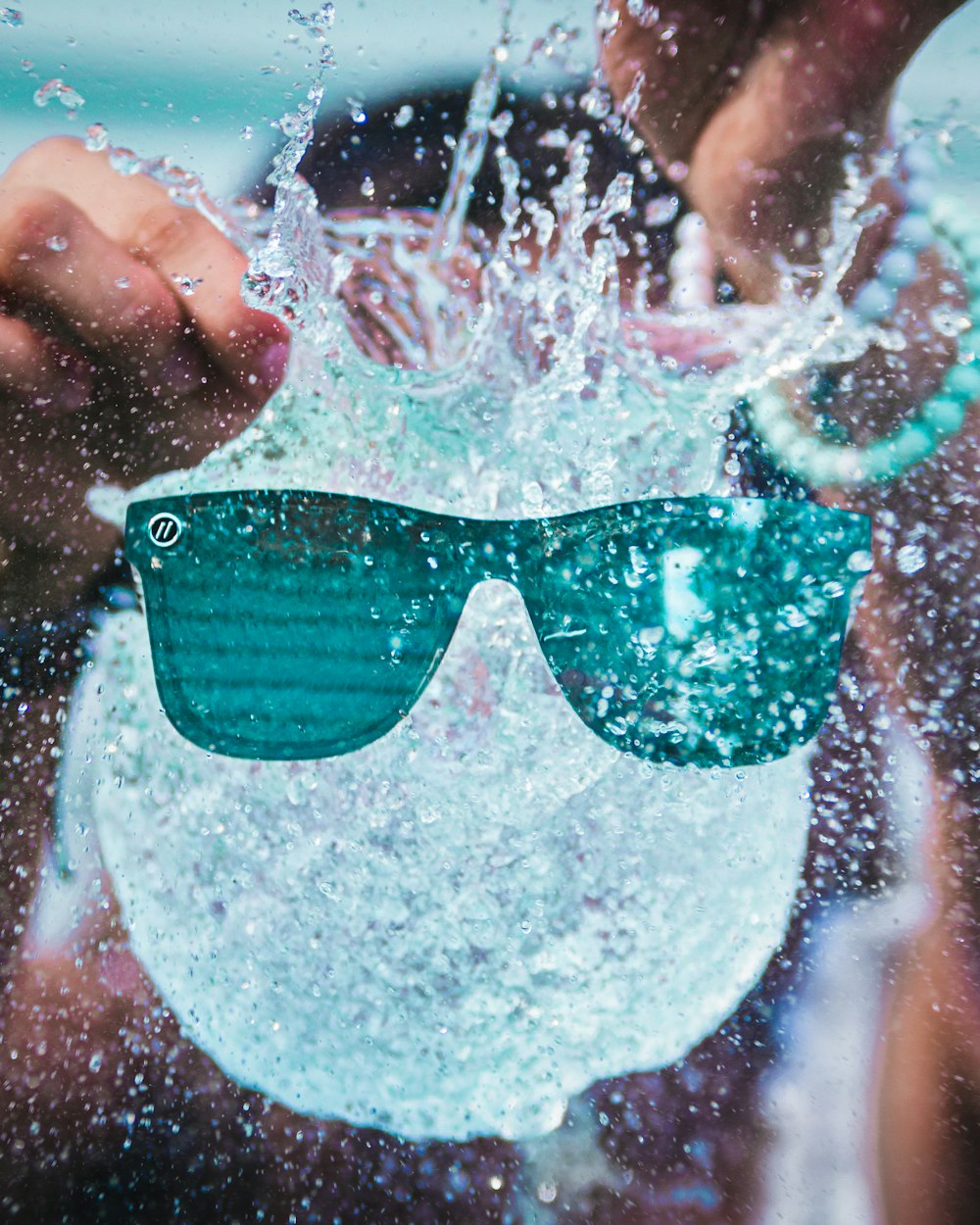 person holding sunglasses