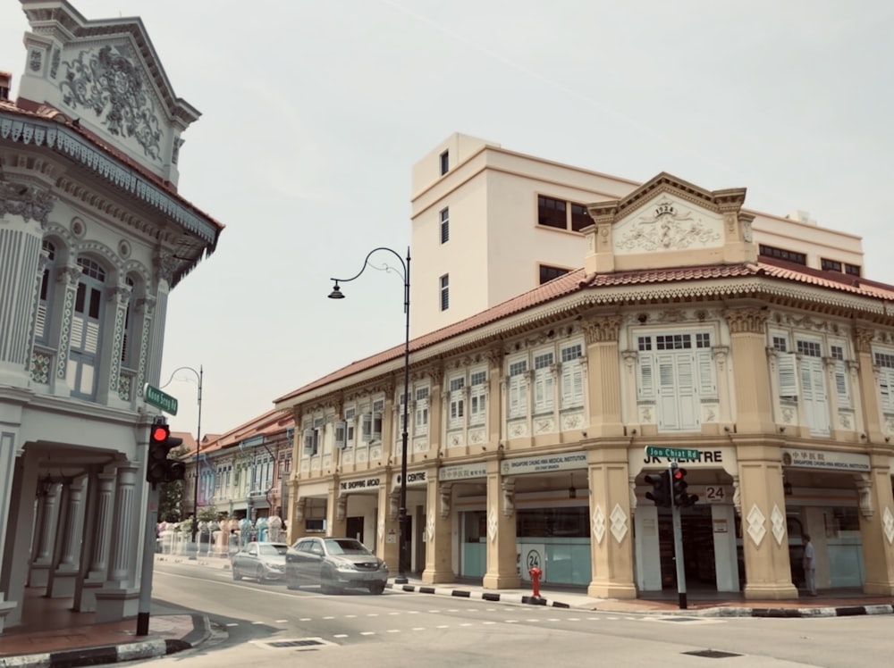 two vehicles beside buildings