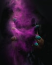 time-lapse photography of person spreading purple powder