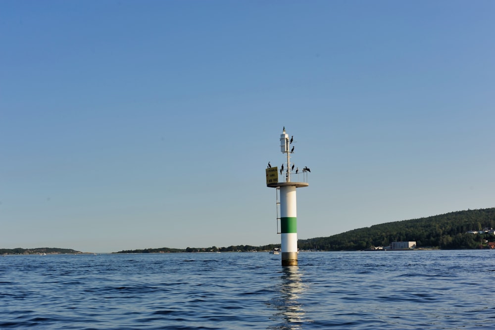 a large body of water with a tower in the middle of it