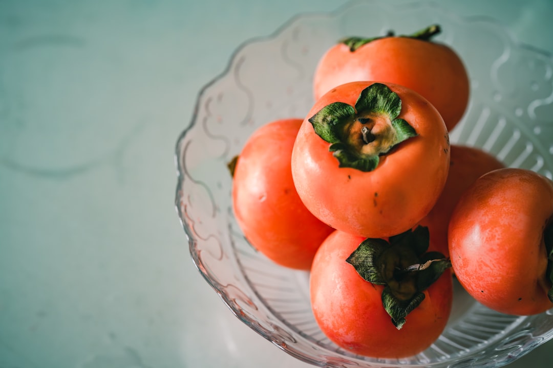 orange pomegranates in bowl