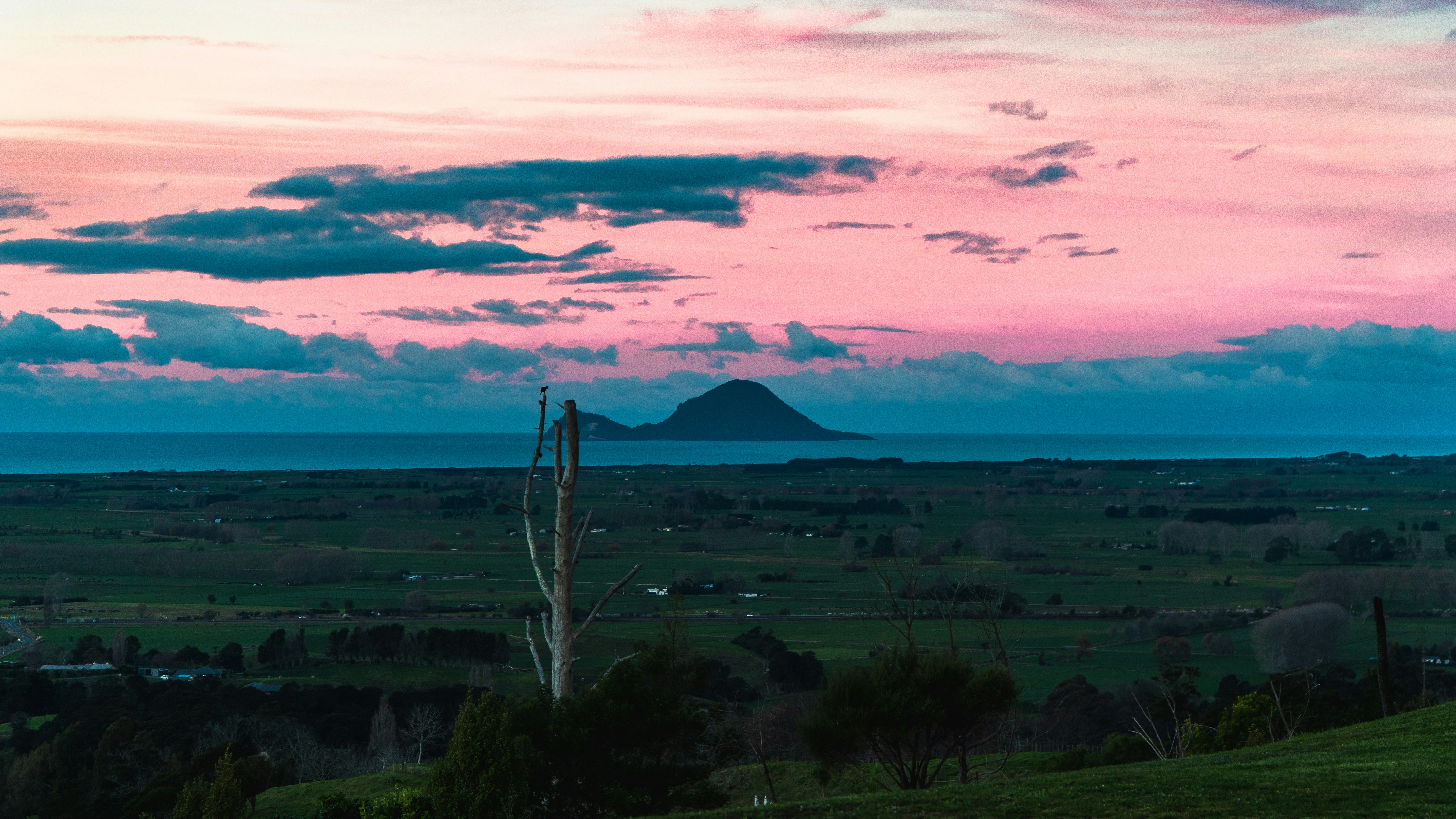 A view of a field with a mountain in the distance photo – Free Nature ...
