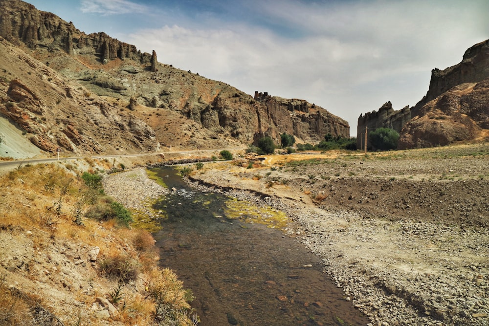 a river in the middle of a rocky area