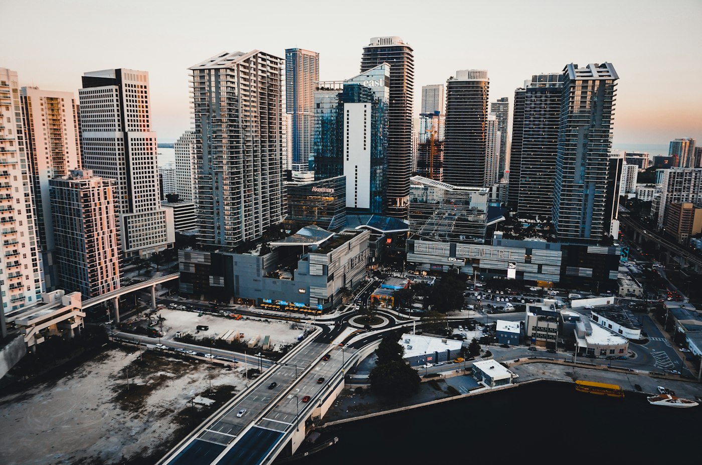 Aerial view of Brickell high-rise towers and the Miami River at dusk