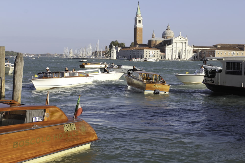 sailing brown and white boats during daytime