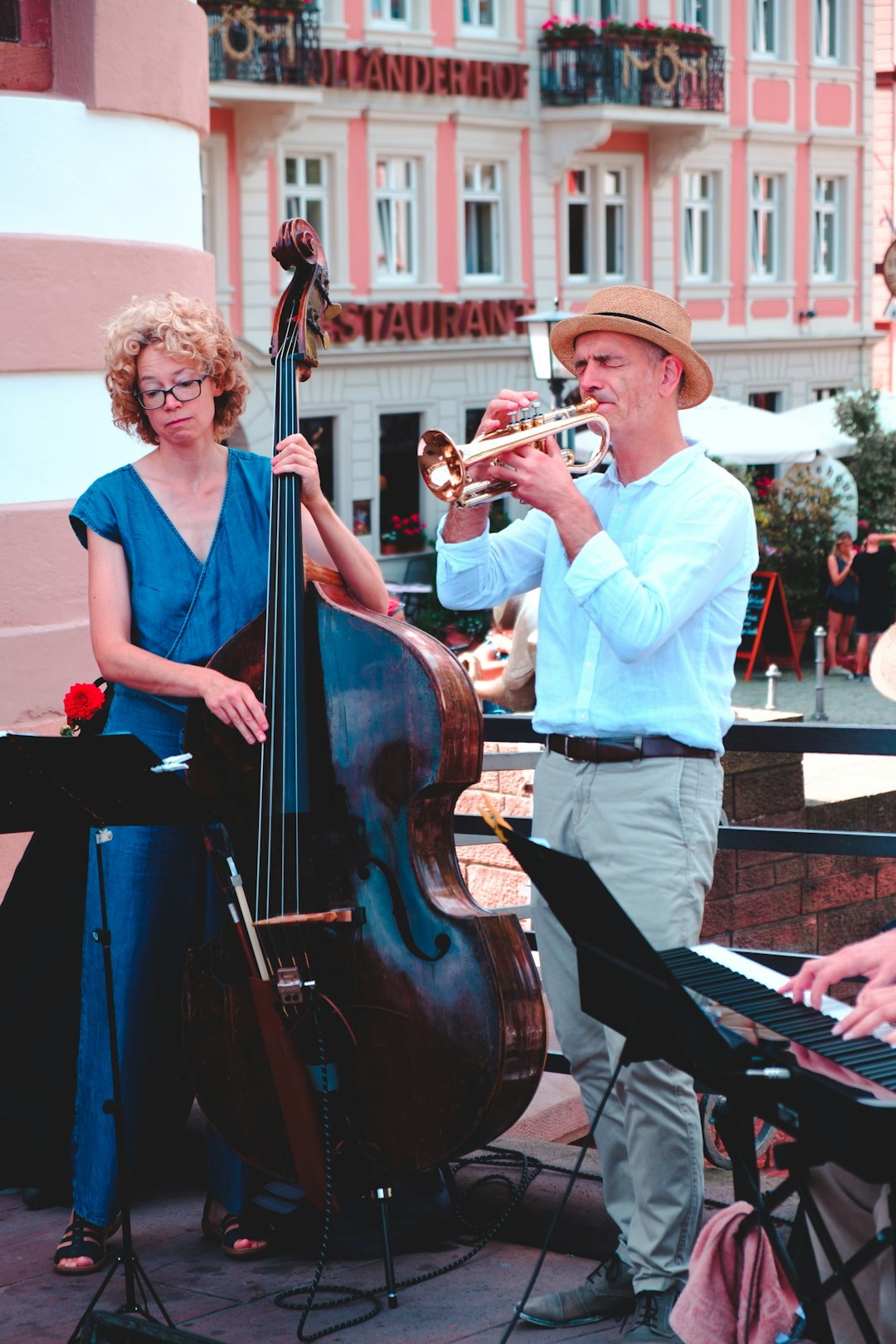 man and woman playing musical instruments