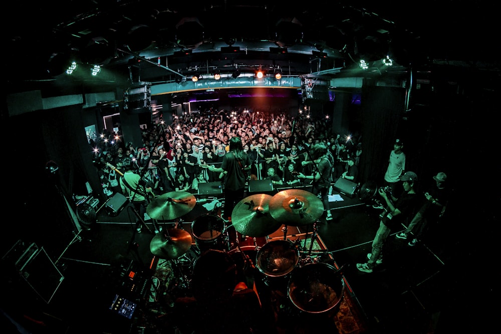 man performing on stage front of people