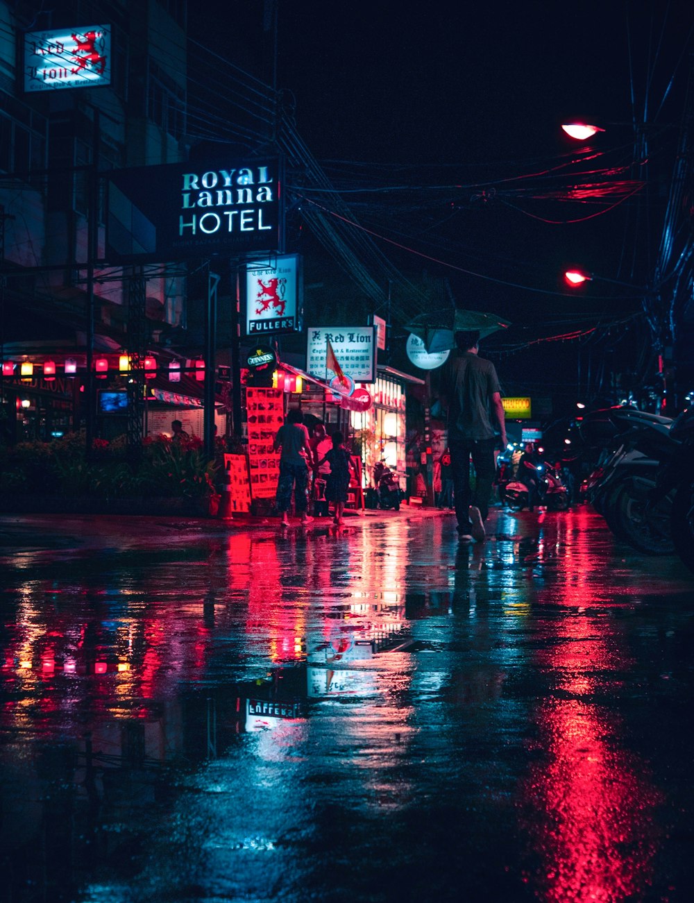 people walking on busy street during night time