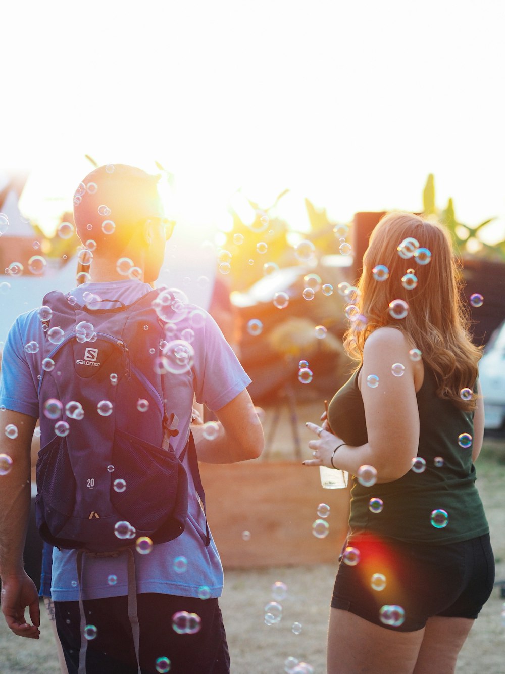 couple standing near bubbles