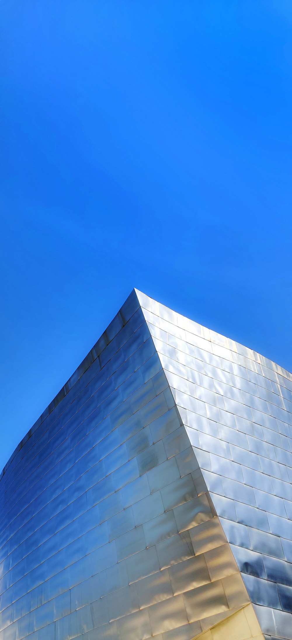 gray painted building under blue sky