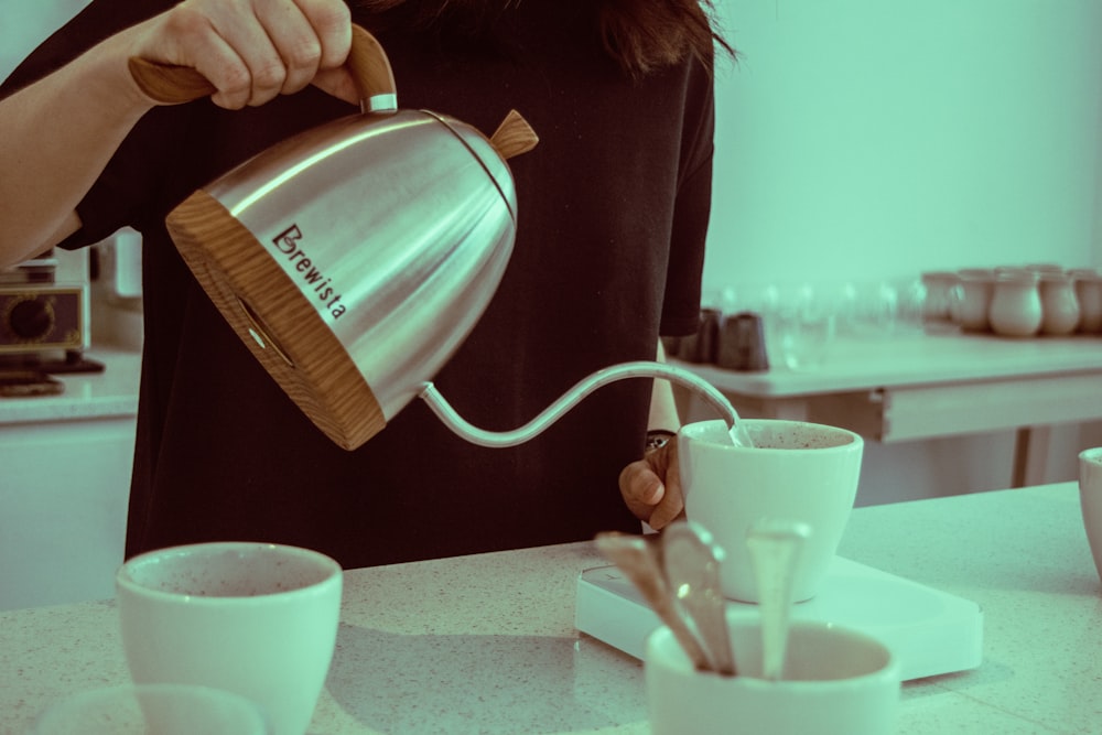 brown and silver Brewista kettle