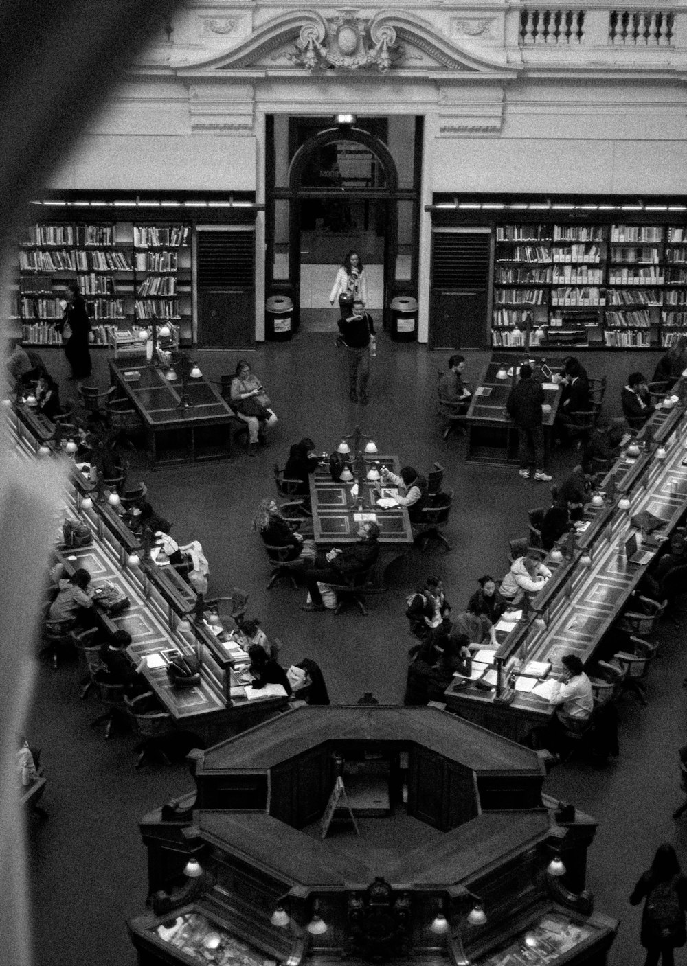 grayscale photography of people inside building