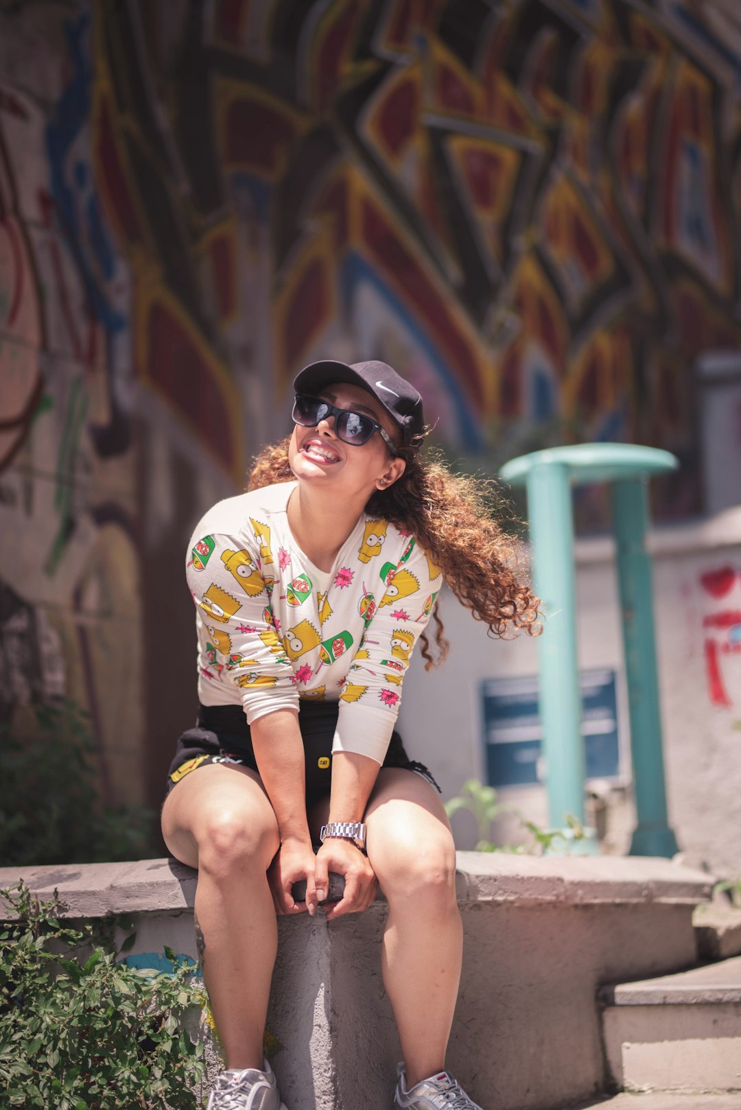 woman sitting on concrete surface